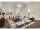 Bright living room featuring high ceilings, modern furniture, and stylish decor, creating an inviting and comfortable space at 8527 Firestone Cir, Clermont, FL 34711