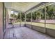 Relaxing screened in patio with tiled floor at 8527 Firestone Cir, Clermont, FL 34711