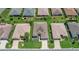 Aerial view of well-maintained homes with lush lawns and landscaping in a tranquil neighborhood at 8652 Se 133Rd Ln, Summerfield, FL 34491