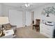 Neutral bedroom featuring carpet floors, a ceiling fan, and a writing table at 8652 Se 133Rd Ln, Summerfield, FL 34491