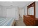 Neutral bedroom with a wooden dresser, mirror, carpet floors and closet at 8652 Se 133Rd Ln, Summerfield, FL 34491