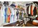 Walk-in closet with plenty of hanging storage, shelves, and shoe racks for organization at 8652 Se 133Rd Ln, Summerfield, FL 34491