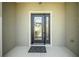 Close-up of the beautiful front door with glass detailing and a decorative wreath at 8652 Se 133Rd Ln, Summerfield, FL 34491