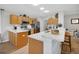 Well-equipped kitchen with stainless steel appliances, marble countertops, and wood cabinets, offering modern convenience at 8652 Se 133Rd Ln, Summerfield, FL 34491