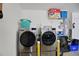 Convenient laundry area equipped with modern, front-load washer and dryer units at 8652 Se 133Rd Ln, Summerfield, FL 34491