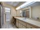 Large bathroom with a spacious vanity, shower, and abundant natural light at 8712 Sw 92Nd Pl # D, Ocala, FL 34481