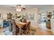 Dining room with wood table, wicker chairs, and rustic decor at 8712 Sw 92Nd Pl # D, Ocala, FL 34481