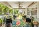 Charming porch with a ceiling fan, comfortable seating, and views of the neighborhood at 8712 Sw 92Nd Pl # D, Ocala, FL 34481
