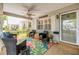 Inviting covered front porch with seating area, ceiling fan, and a welcoming entrance at 8712 Sw 92Nd Pl # D, Ocala, FL 34481