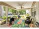 Relaxing covered front porch with comfortable seating and views of the surrounding landscape at 8712 Sw 92Nd Pl # D, Ocala, FL 34481