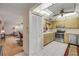 View of kitchen with direct access to the living and dining room at 8712 Sw 92Nd Pl # D, Ocala, FL 34481