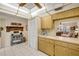 Bright kitchen features ample cabinet space and white tile floors at 8712 Sw 92Nd Pl # D, Ocala, FL 34481