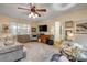 Comfortable living room features a ceiling fan, plush rug, and stylish decor at 8712 Sw 92Nd Pl # D, Ocala, FL 34481