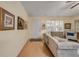 Inviting living room with light wood floors and a window with shutter blinds at 8712 Sw 92Nd Pl # D, Ocala, FL 34481