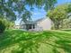 Lovely backyard with a screened lanai and lush green lawn, perfect for outdoor enjoyment at 8980 Se 178Th Muirfield Pl, The Villages, FL 32162