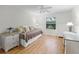 Bedroom offering natural light, wood-look floors and bright decor at 8980 Se 178Th Muirfield Pl, The Villages, FL 32162
