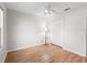Neutral bedroom featuring a ceiling fan, closet and wood-look floors at 8980 Se 178Th Muirfield Pl, The Villages, FL 32162