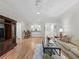 Bright living room with wood floors, stylish decor, and an open layout at 8980 Se 178Th Muirfield Pl, The Villages, FL 32162