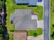Aerial view of the backyard and roof of a single-Gathering home with mature landscaping at 10994 Se 168Th Loop, Summerfield, FL 34491