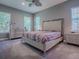 Bedroom with natural light, neutral walls, ceiling fan, soft carpet and luxury furniture at 10994 Se 168Th Loop, Summerfield, FL 34491