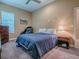 This bedroom features carpet, neutral walls, and a relaxing ambiance at 10994 Se 168Th Loop, Summerfield, FL 34491