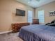 Bedroom with carpet, neutral walls, and wood furnishings at 10994 Se 168Th Loop, Summerfield, FL 34491