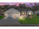 Charming single-Gathering home featuring a three-car garage, manicured lawn, and inviting curb appeal, perfect for Gathering living at 10994 Se 168Th Loop, Summerfield, FL 34491