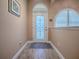 Home entrance with an ornate front door and detailed trim at 10994 Se 168Th Loop, Summerfield, FL 34491
