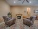 Living room showcasing a stone fireplace and comfortable furniture at 10994 Se 168Th Loop, Summerfield, FL 34491
