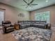Spacious living room boasts sectional sofa, accent chair, area rug, and ample seating at 10994 Se 168Th Loop, Summerfield, FL 34491
