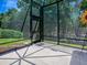View from the screened in porch showcasing a spacious, private backyard surrounded by mature trees at 10994 Se 168Th Loop, Summerfield, FL 34491