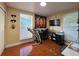 Bedroom with a home office, window with natural light and tiled floor at 1104 Flamingo Dr, Leesburg, FL 34748