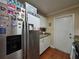 This modern kitchen showcases stainless steel appliances, and tile floors at 1104 Flamingo Dr, Leesburg, FL 34748