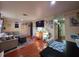 Comfortable living room features tile floors and view to kitchen at 1104 Flamingo Dr, Leesburg, FL 34748