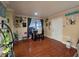 Charming living room featuring stylish decor, warm-toned walls, and large windows, creating a welcoming atmosphere at 1104 Flamingo Dr, Leesburg, FL 34748