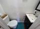 Functional powder room with a toilet, vanity, and modern fixtures, designed for convenience and style at 1104 Flamingo Dr, Leesburg, FL 34748