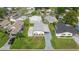 Aerial view of a well-maintained single-story home with a carport and landscaped yard in a residential area at 1146 W Boone Ct, Lady Lake, FL 32159