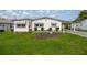 Charming single-story home with a well-manicured lawn and tidy landscaping at 1146 W Boone Ct, Lady Lake, FL 32159