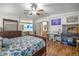 Main bedroom with extra space for sewing and views to main bathroom at 1146 W Boone Ct, Lady Lake, FL 32159
