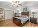 Spacious main bedroom with wood flooring and a large closet at 1146 W Boone Ct, Lady Lake, FL 32159