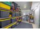 Organized storage room with shelving units filled with storage bins and various household items at 1146 W Boone Ct, Lady Lake, FL 32159