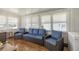 Relaxing sunroom featuring a full set of furniture and plenty of natural light at 1146 W Boone Ct, Lady Lake, FL 32159