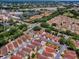 Aerial view of the property in a community near stores, golf courses and a lake at 1202 Fernando Ln, The Villages, FL 32159