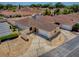 Aerial view of the home showcasing its well-maintained exterior, neat landscaping, and convenient parking at 1202 Fernando Ln, The Villages, FL 32159