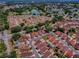 Aerial view of the property in a well-situated community close to golf courses and a lake at 1202 Fernando Ln, The Villages, FL 32159