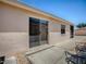 The back patio offers a seamless indoor-outdoor transition with sliding glass doors and comfortable seating at 1202 Fernando Ln, The Villages, FL 32159