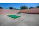Outdoor patio includes a putting green and patio furniture with table and chairs at 1202 Fernando Ln, The Villages, FL 32159