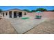 Backyard featuring a putting green, patio, and a view of the screened lanai at 1202 Fernando Ln, The Villages, FL 32159