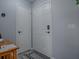 Clean entryway with a secure, modern door lock, and a convenient coat closet at 1202 Fernando Ln, The Villages, FL 32159