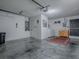 Spacious garage with laundry area, ample storage, and access to home, perfect for organization and convenience at 1202 Fernando Ln, The Villages, FL 32159
